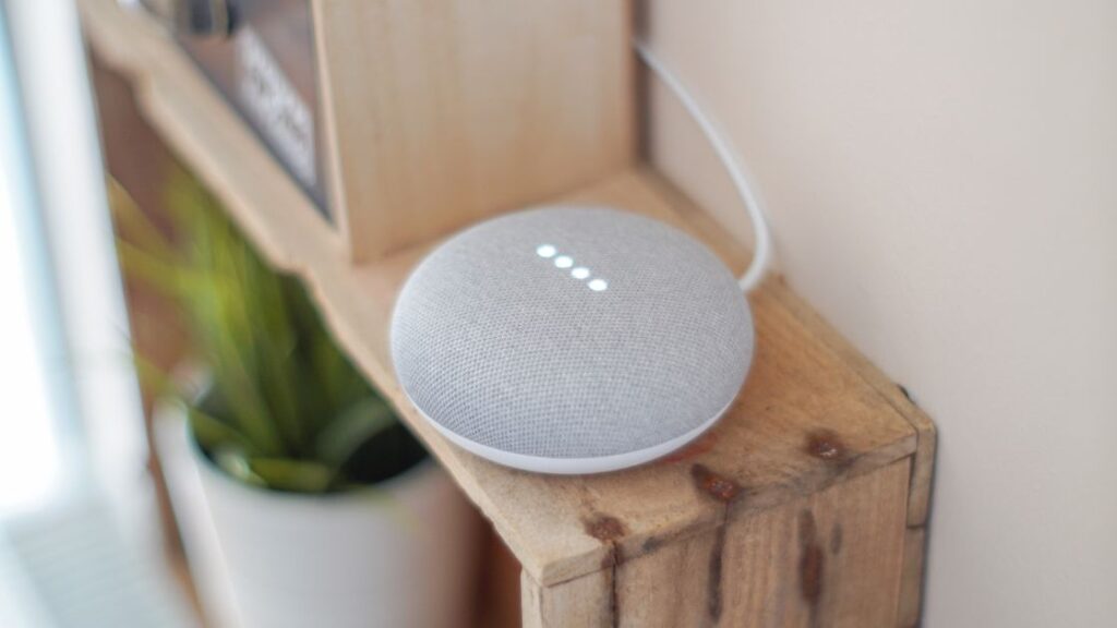 Google Home Assistant sitting on a shelf