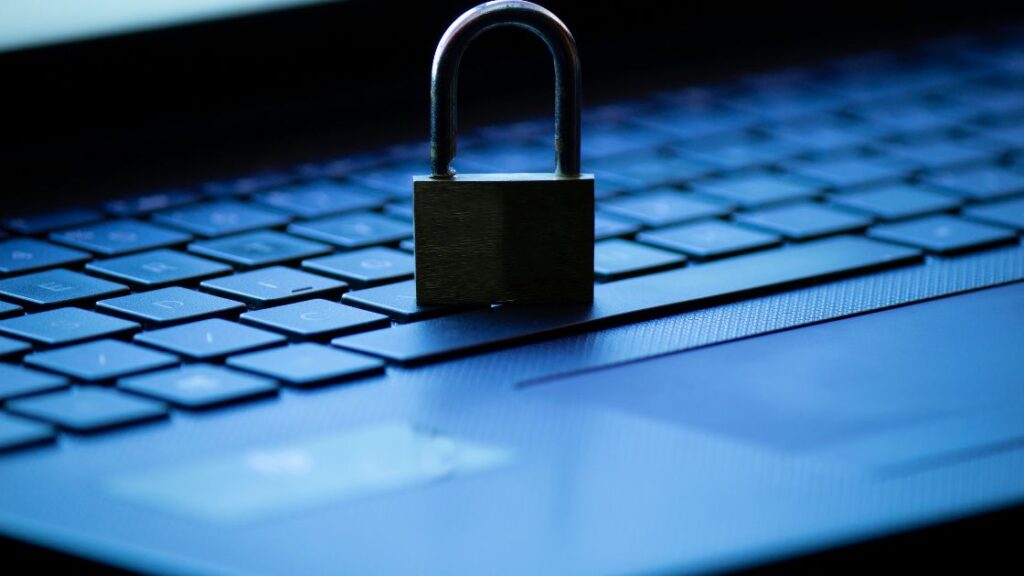 Privacy lock sitting on a laptop keyboard
